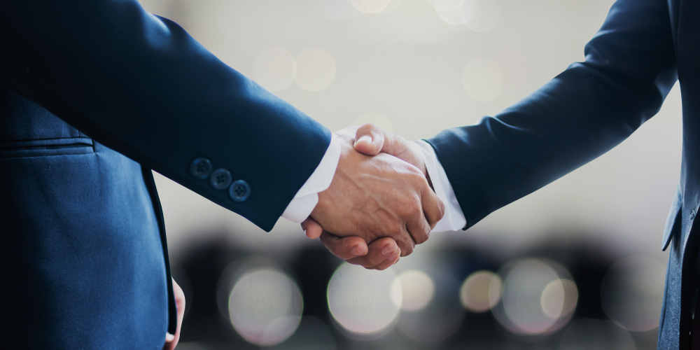 Image of two businessmen shaking hands